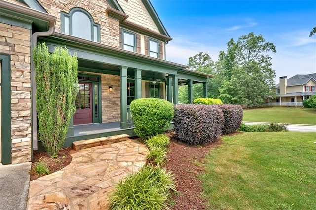 17 River Walk Pkwy, Euharlee, GA 30145 - property entrance with a porch, stone siding, and a yard