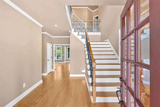 17 River Walk Pkwy, Euharlee, GA 30145 - stairs featuring french doors, baseboards, ornamental molding, wood finished floors, and recessed lighting