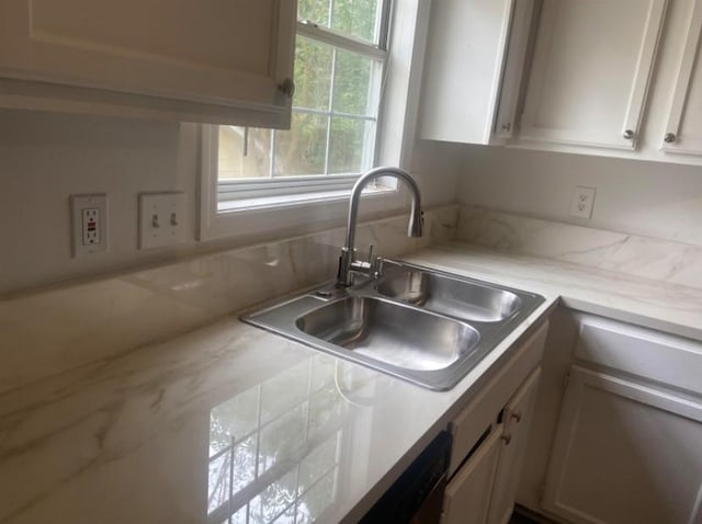 kitchen with white cabinets and sink