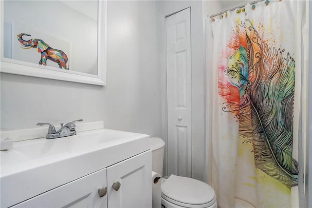 bathroom featuring vanity and toilet