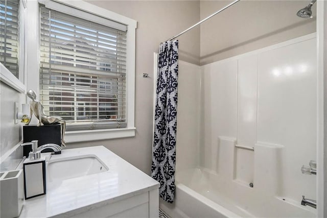 bathroom featuring shower / bath combo and vanity