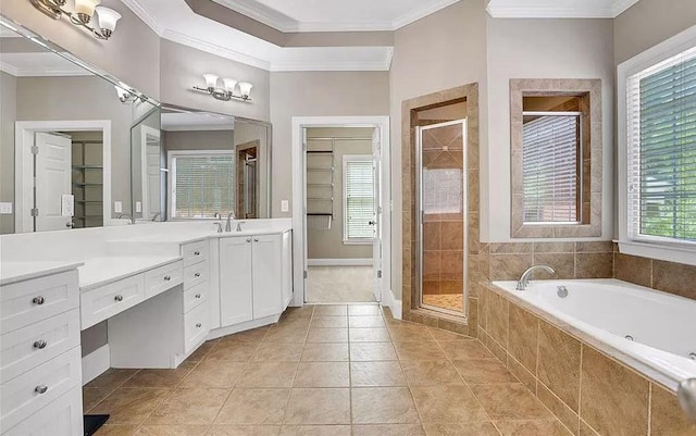 bathroom featuring vanity, crown molding, a garden tub, and a stall shower