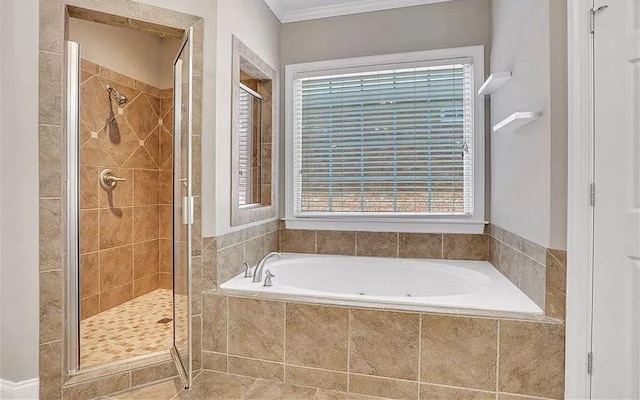 full bath featuring tile patterned floors, a garden tub, a shower stall, and crown molding