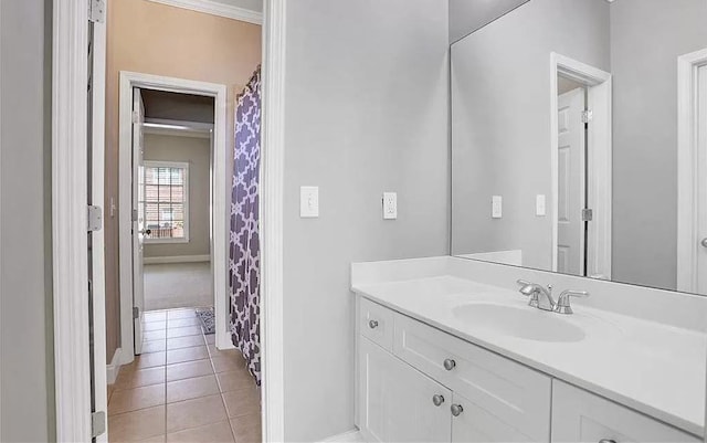 full bathroom featuring baseboards, vanity, and tile patterned flooring