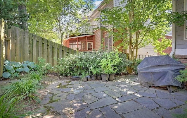 view of patio / terrace featuring fence