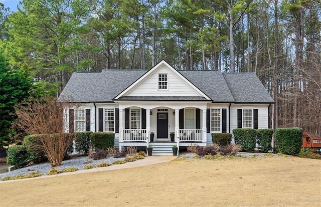 view of front of house featuring a porch and a front lawn