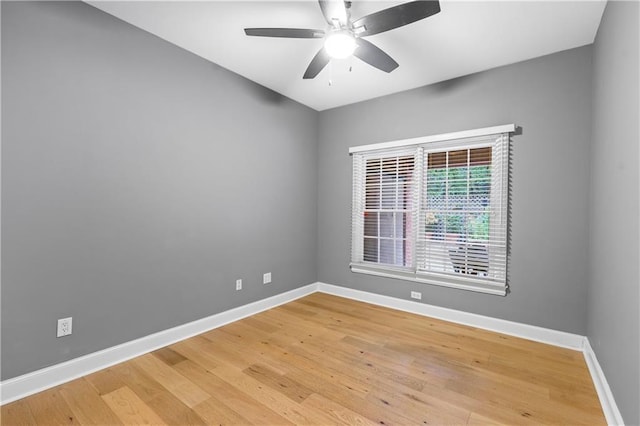 unfurnished room with hardwood / wood-style flooring and ceiling fan