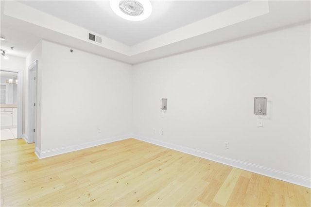 spare room featuring light hardwood / wood-style floors