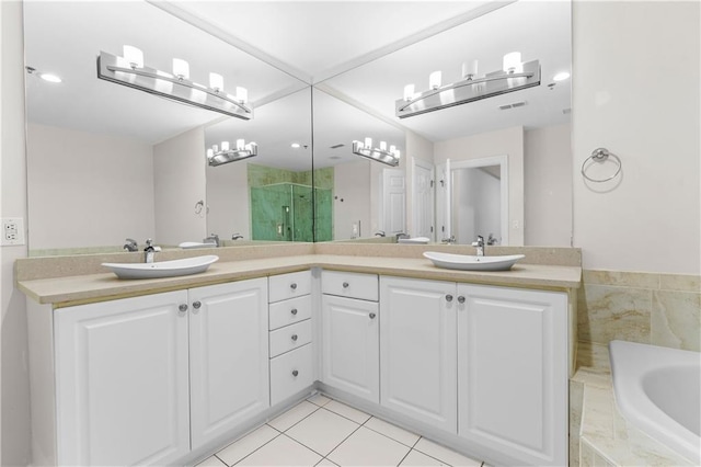 bathroom featuring tile patterned flooring, vanity, and independent shower and bath