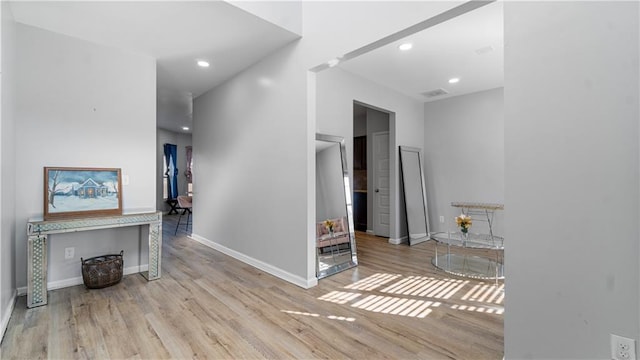 hall with light hardwood / wood-style flooring