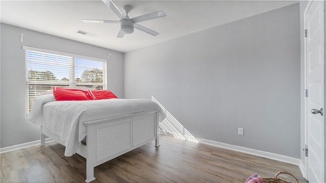 bedroom with ceiling fan and hardwood / wood-style floors