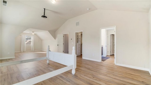 additional living space featuring ceiling fan, lofted ceiling, and light hardwood / wood-style floors