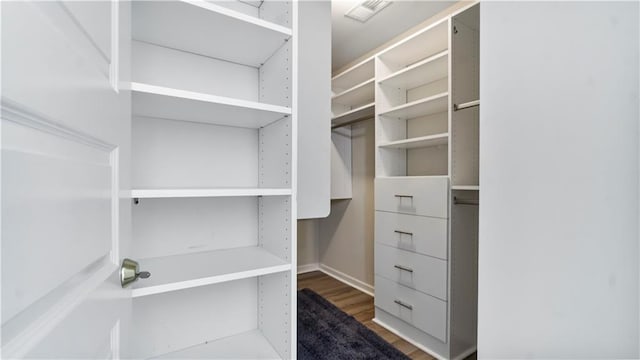 walk in closet featuring hardwood / wood-style floors