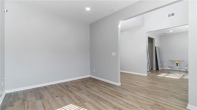 spare room featuring light wood-type flooring