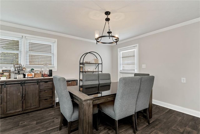 dining room with dark wood finished floors, a notable chandelier, baseboards, and ornamental molding