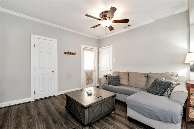 living area with dark wood-style flooring, baseboards, a ceiling fan, and ornamental molding