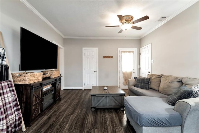 living room with dark wood-style floors, visible vents, crown molding, and a ceiling fan