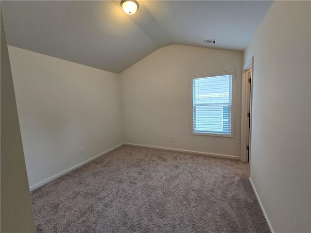 5521 Shallow Branch Dr, Flowery Branch, GA 30542 - bonus room with lofted ceiling, carpet floors, and baseboards
