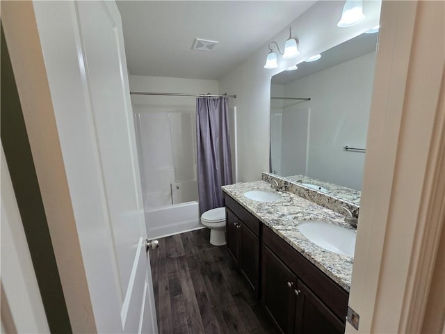 5521 Shallow Branch Dr, Flowery Branch, GA 30542 - bathroom with wood finished floors, shower / tub combo, toilet, and double vanity