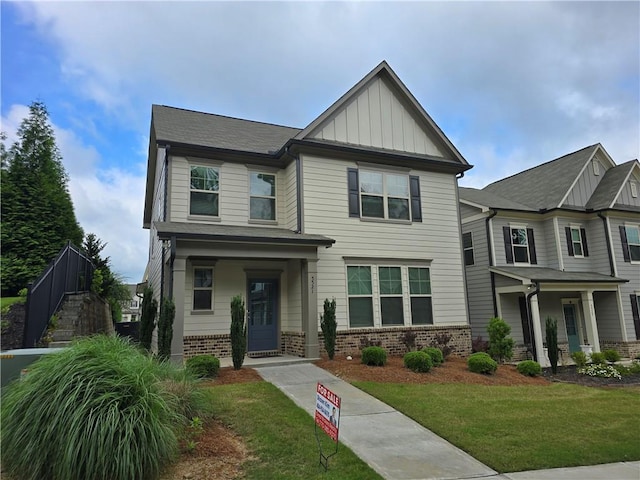 5521 Shallow Branch Dr, Flowery Branch, GA 30542 - craftsman house featuring brick siding, board and batten siding, and a front yard