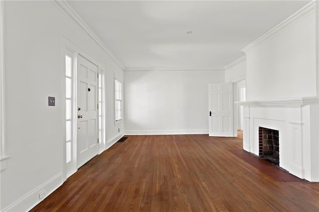 unfurnished living room featuring dark wood finished floors, a fireplace with flush hearth, baseboards, and ornamental molding