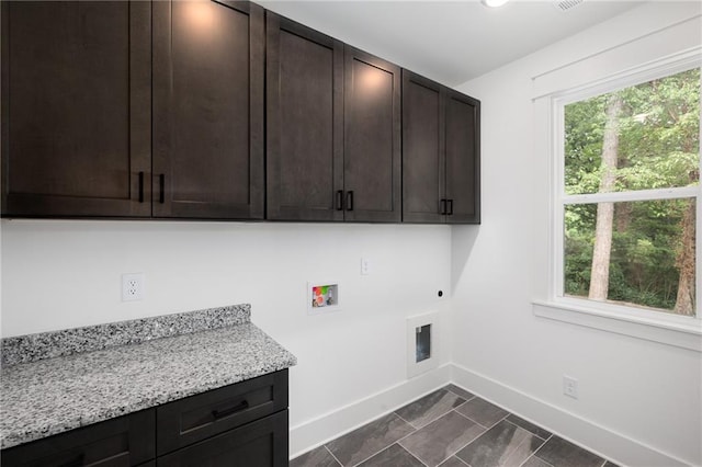 laundry area with cabinets, hookup for an electric dryer, and washer hookup