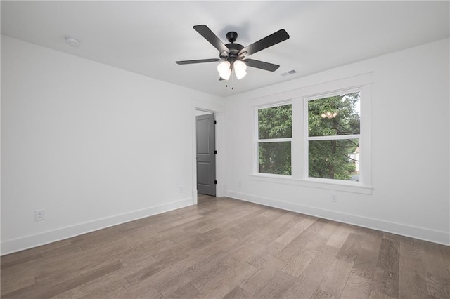 unfurnished room featuring light hardwood / wood-style flooring and ceiling fan