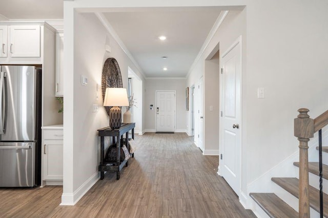 5315 Trescott Path, Cumming, GA 30028 - hall featuring wood finished floors, stairway, crown molding, baseboards, and recessed lighting