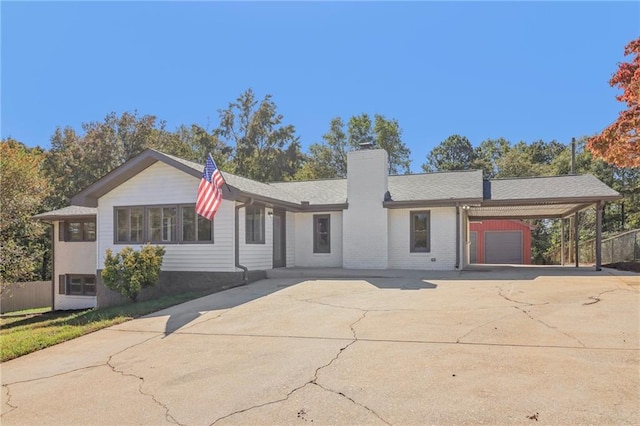 ranch-style home with a carport