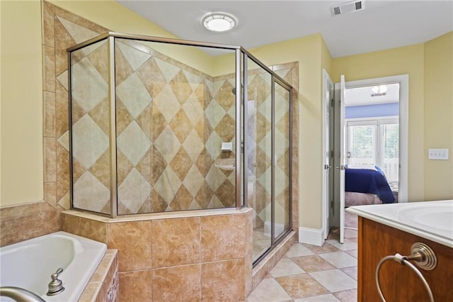 1605 Pavillion Ridge Dr SE, Smyrna, GA 30080 - ensuite bathroom featuring a shower stall, a garden tub, vanity, and tile patterned flooring