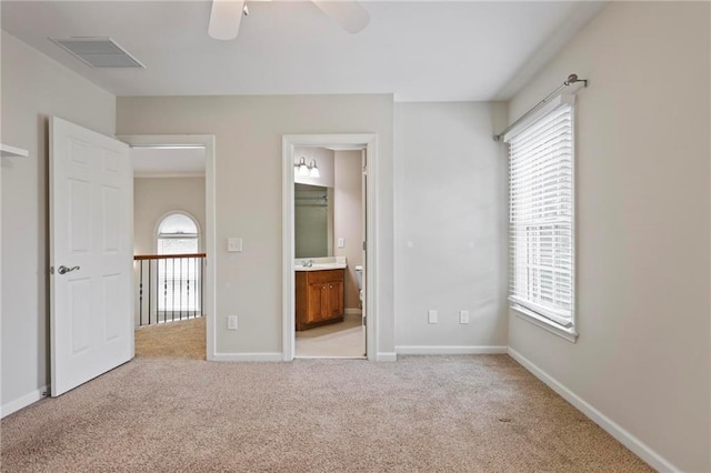 1605 Pavillion Ridge Dr SE, Smyrna, GA 30080 - unfurnished bedroom with multiple windows, light colored carpet, and ensuite bathroom