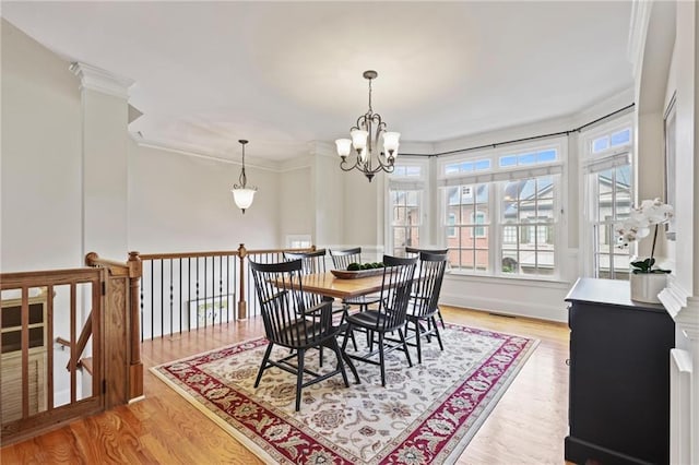 1605 Pavillion Ridge Dr SE, Smyrna, GA 30080 - dining room featuring ornamental molding, light wood-style floors, and a chandelier