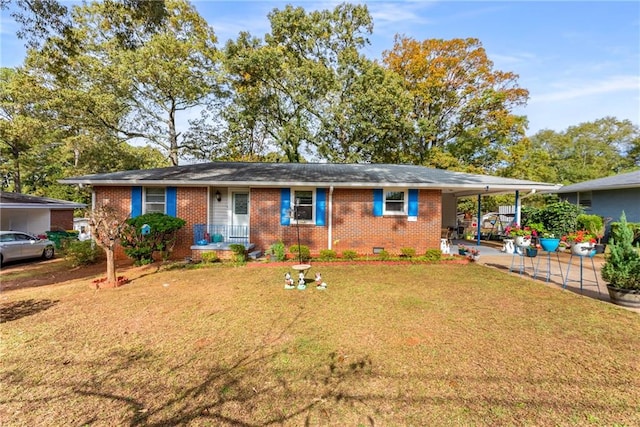 ranch-style home featuring a carport and a front lawn