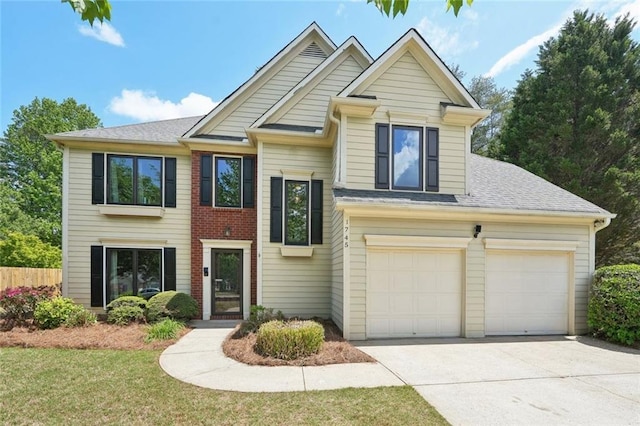 view of front of property with concrete driveway, fence, and a shingled roof