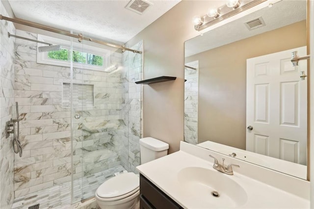 full bath with vanity, toilet, visible vents, and a stall shower