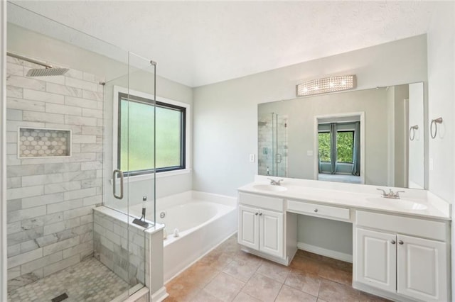 bathroom with a sink, a shower stall, and a bath