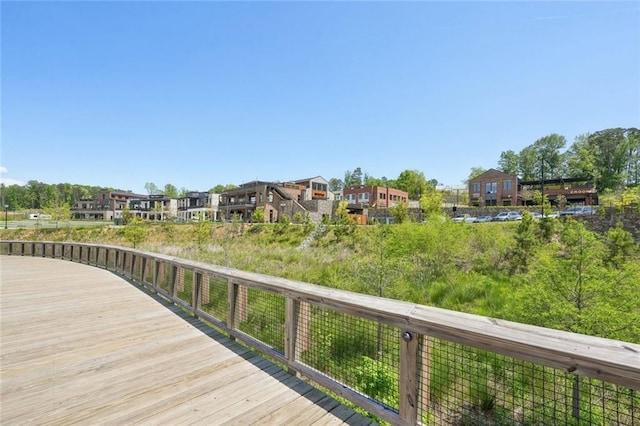 wooden terrace featuring a residential view