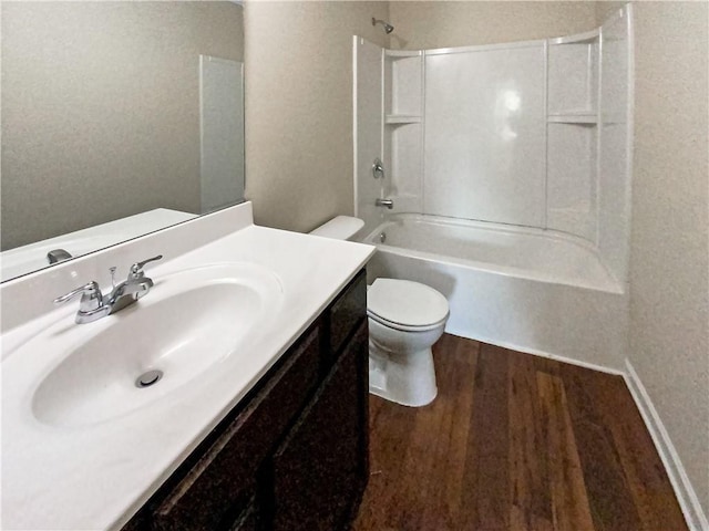 full bathroom featuring shower / tub combination, hardwood / wood-style floors, vanity, and toilet