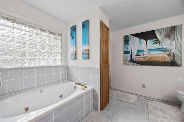 full bath featuring tile patterned floors, toilet, visible vents, a jetted tub, and connected bathroom