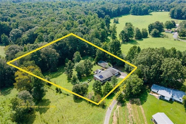 drone / aerial view with a forest view and a rural view
