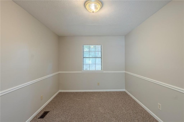 2247 Cherokee Valley Dr, Lithonia, GA 30058 - carpeted empty room with a textured ceiling and baseboards