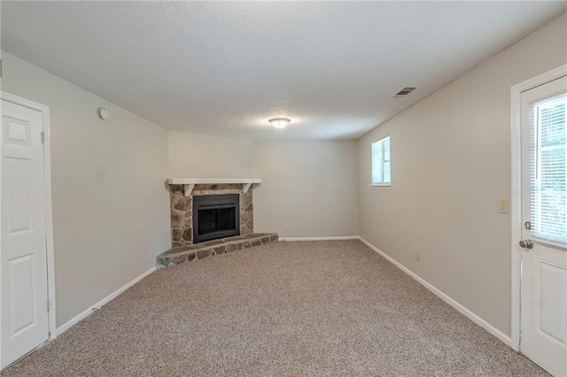 2247 Cherokee Valley Dr, Lithonia, GA 30058 - unfurnished living room with carpet flooring and a fireplace