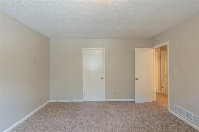 2247 Cherokee Valley Dr, Lithonia, GA 30058 - unfurnished room featuring carpet floors and a textured ceiling