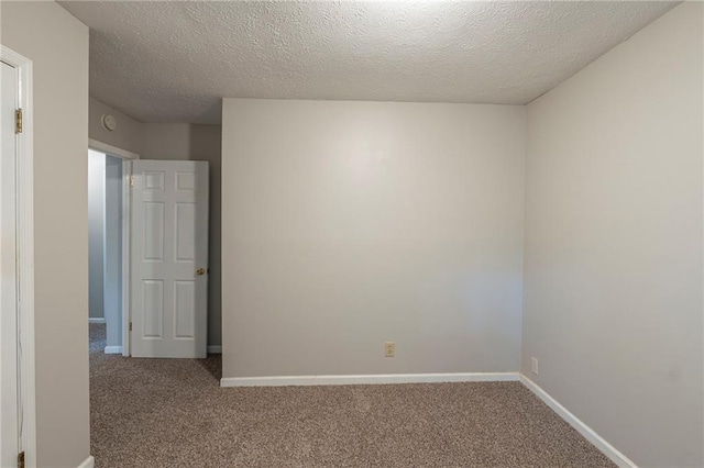 2247 Cherokee Valley Dr, Lithonia, GA 30058 - carpeted empty room with a textured ceiling