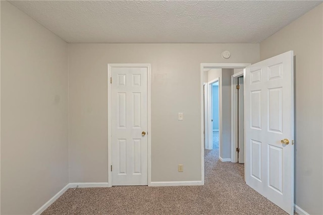 2247 Cherokee Valley Dr, Lithonia, GA 30058 - unfurnished bedroom with carpet flooring and a textured ceiling