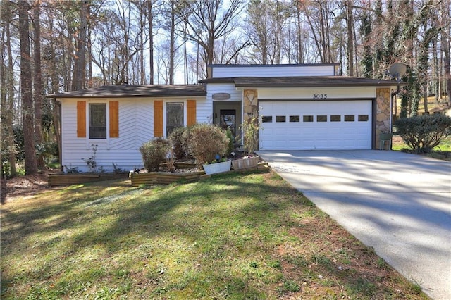 mid-century modern home with stone siding, a front yard, concrete driveway, and an attached garage