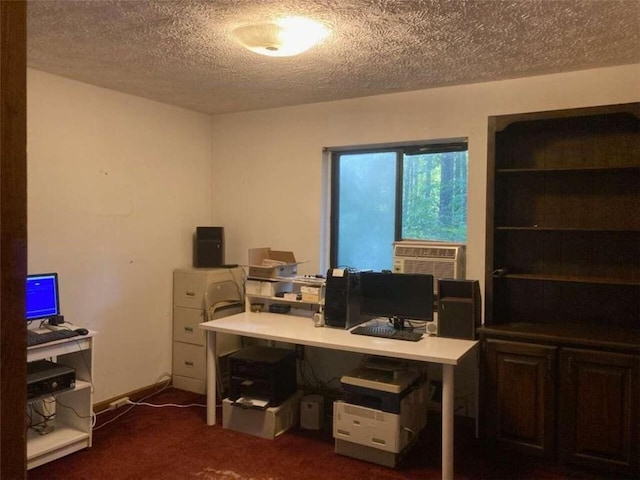 home office with dark colored carpet, a textured ceiling, and cooling unit