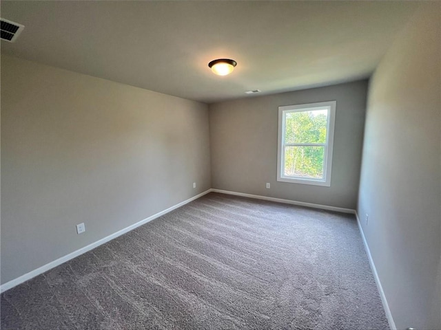 spare room featuring carpet flooring