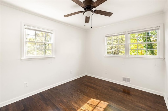 unfurnished room featuring crown molding, ceiling fan, and dark hardwood / wood-style floors