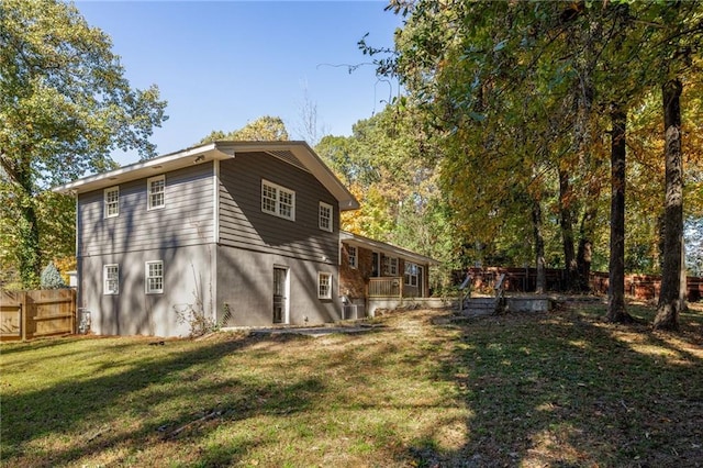 view of side of home featuring a lawn